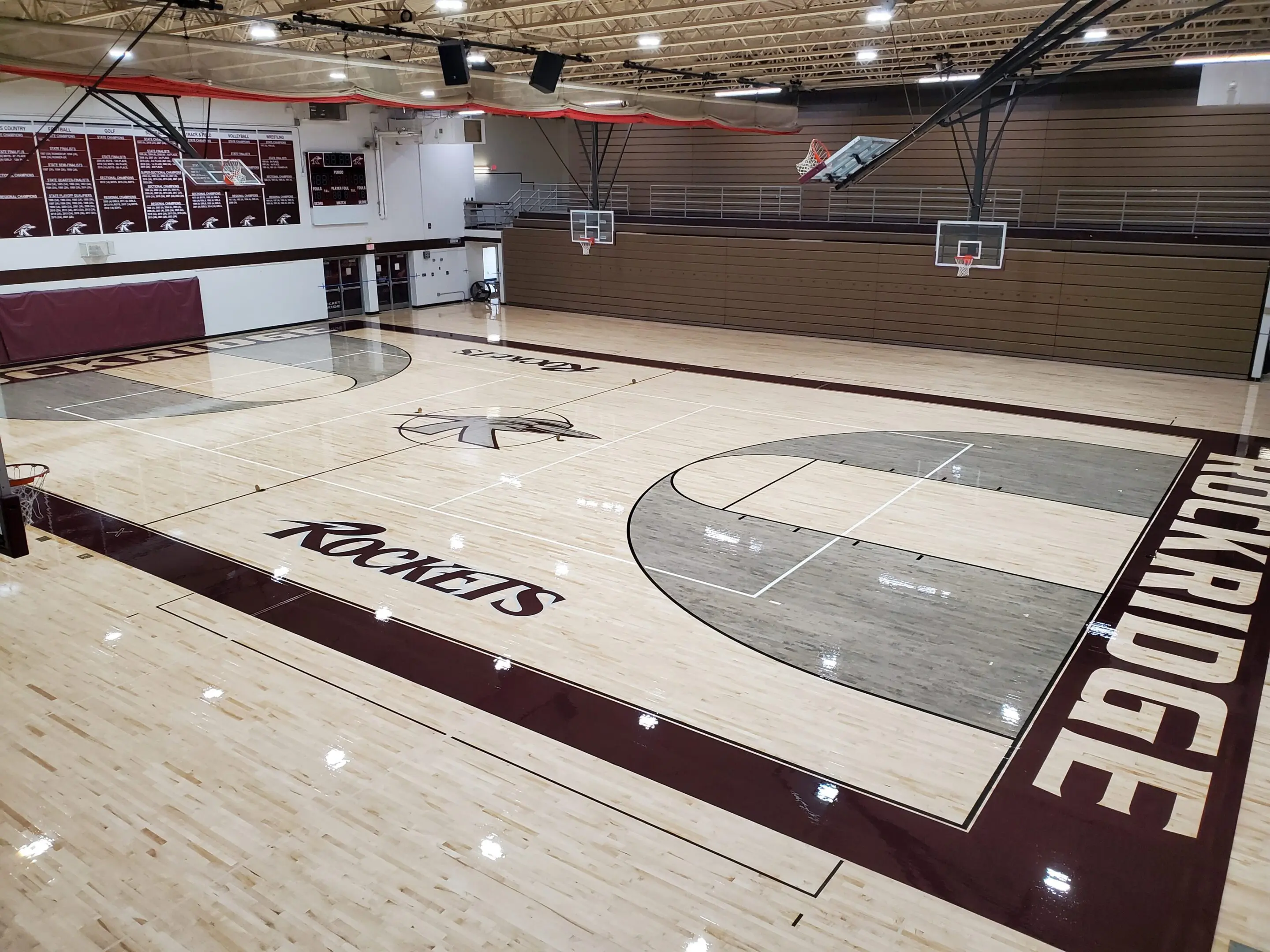 A basketball court with the words " coors " on it.