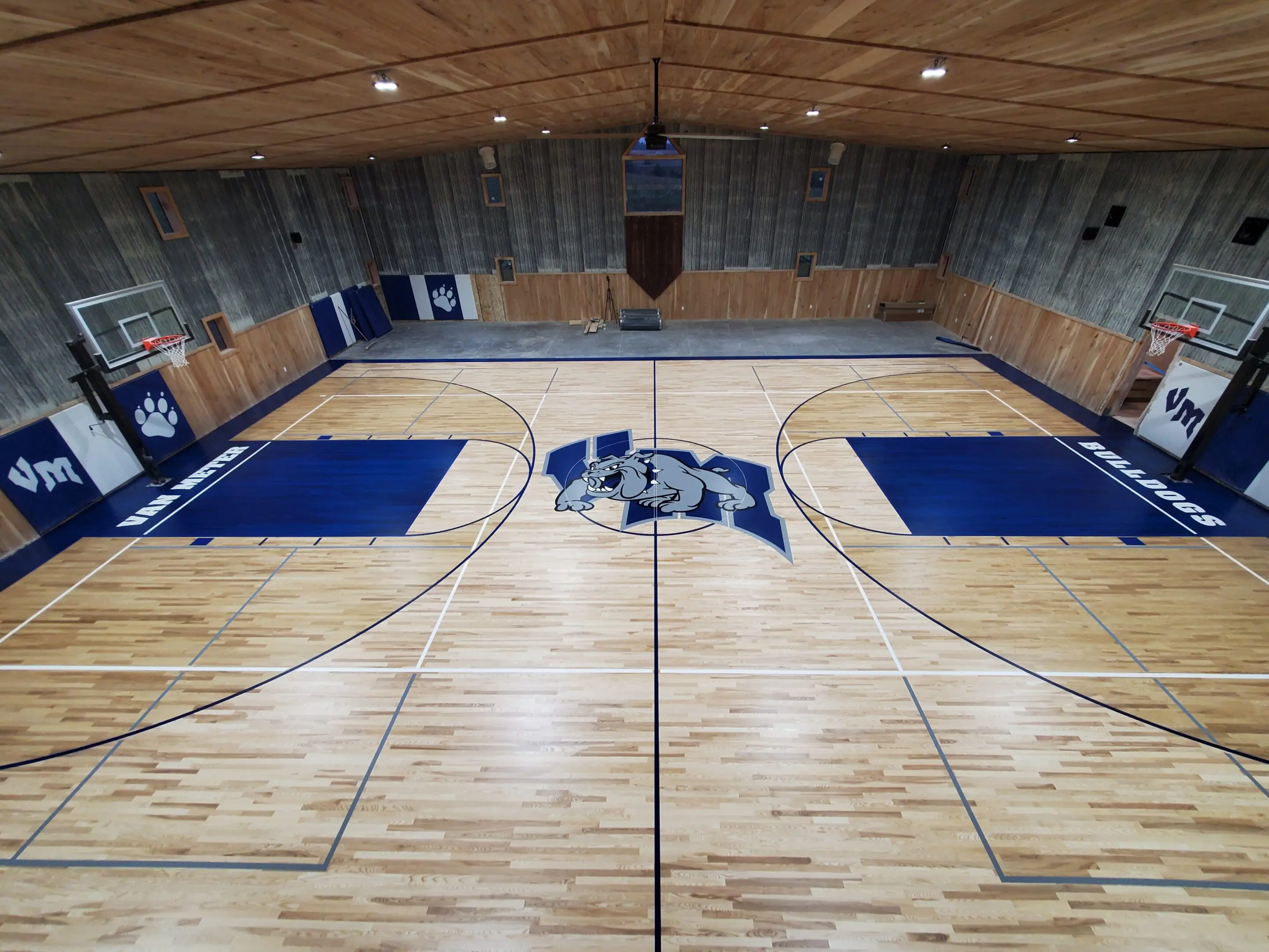 A basketball court with two blue and white mats.