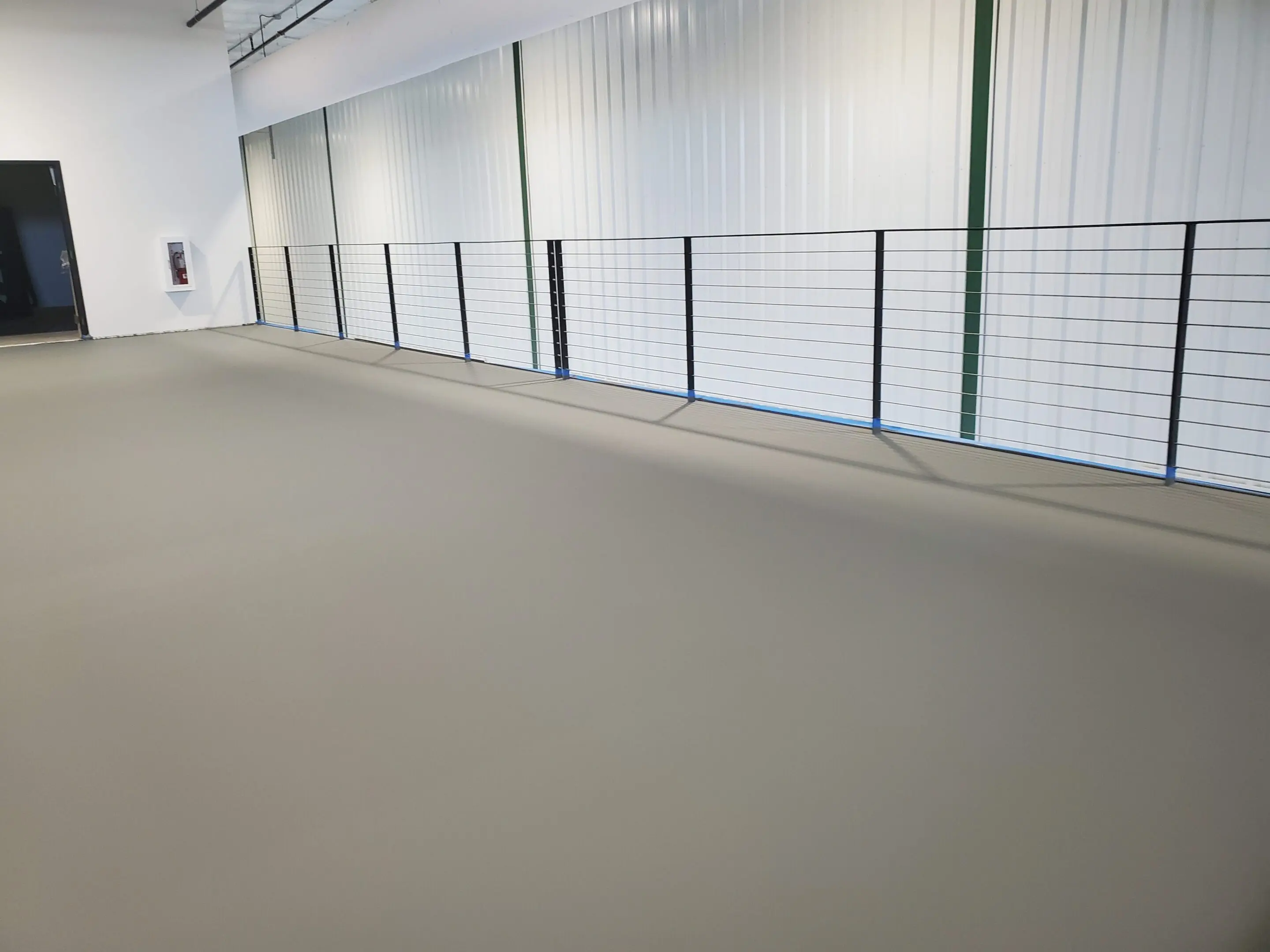 A large room with many windows and walls.