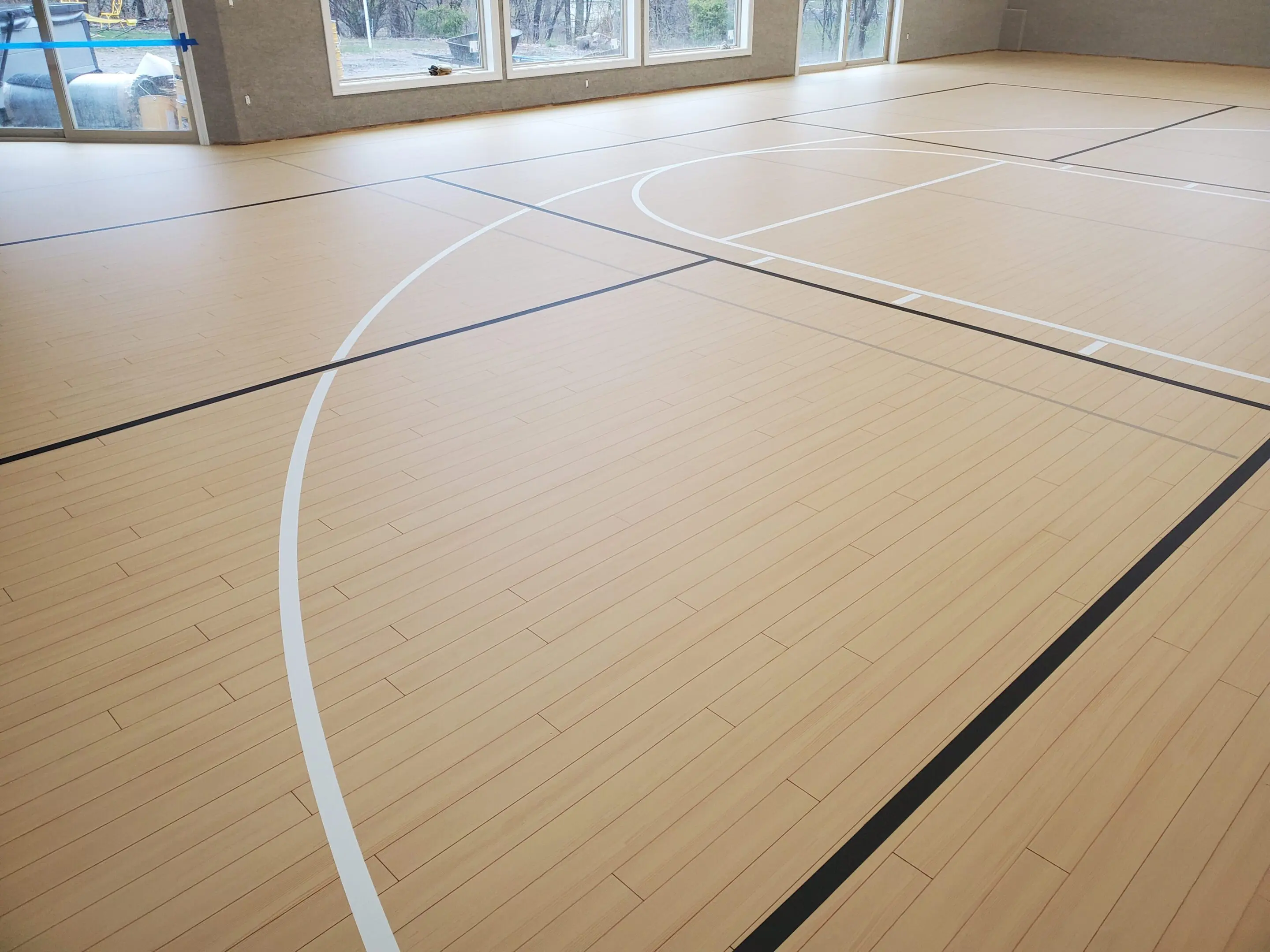 A basketball court with two lines on the floor.