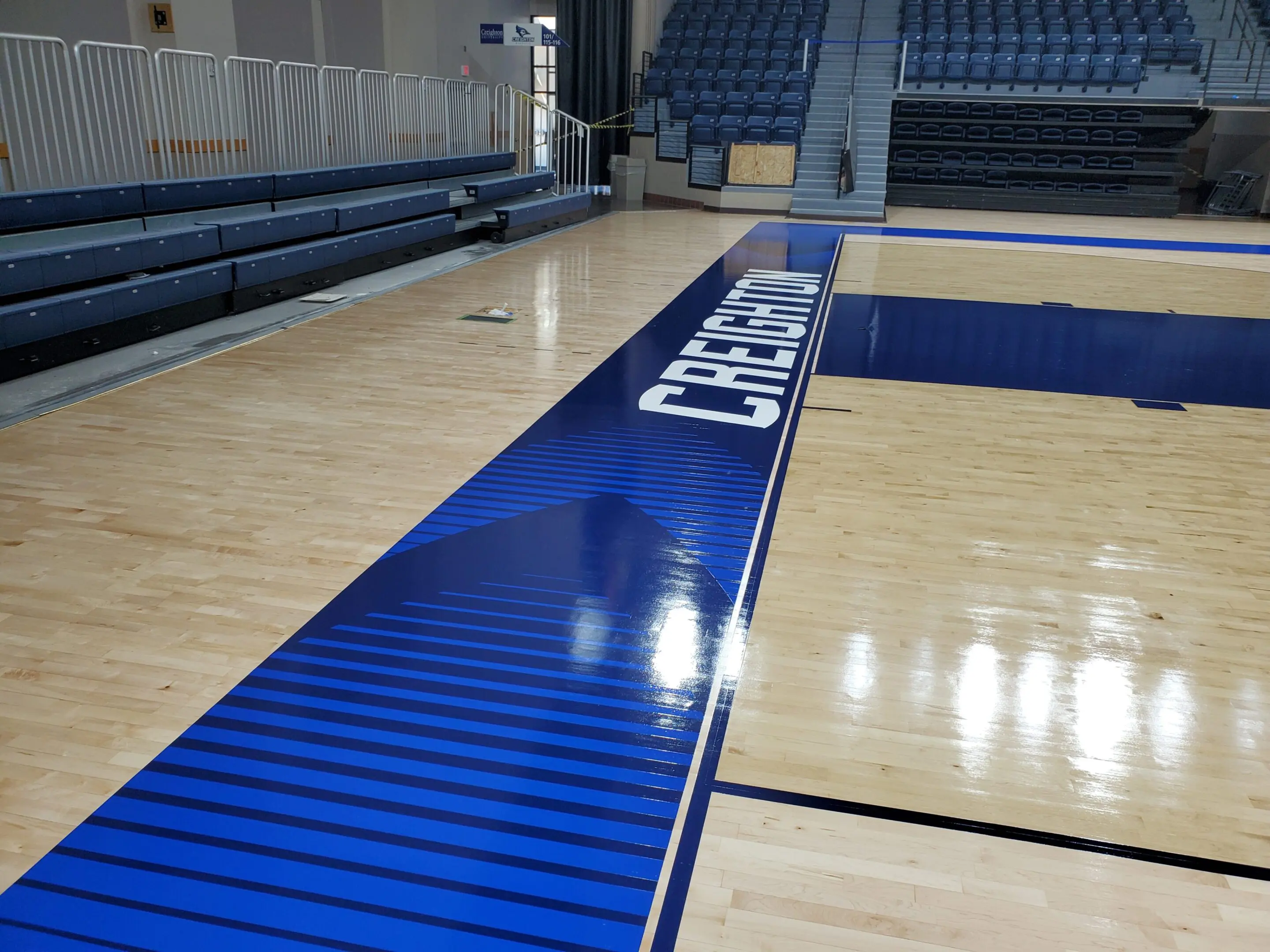 A basketball court with blue and white markings.
