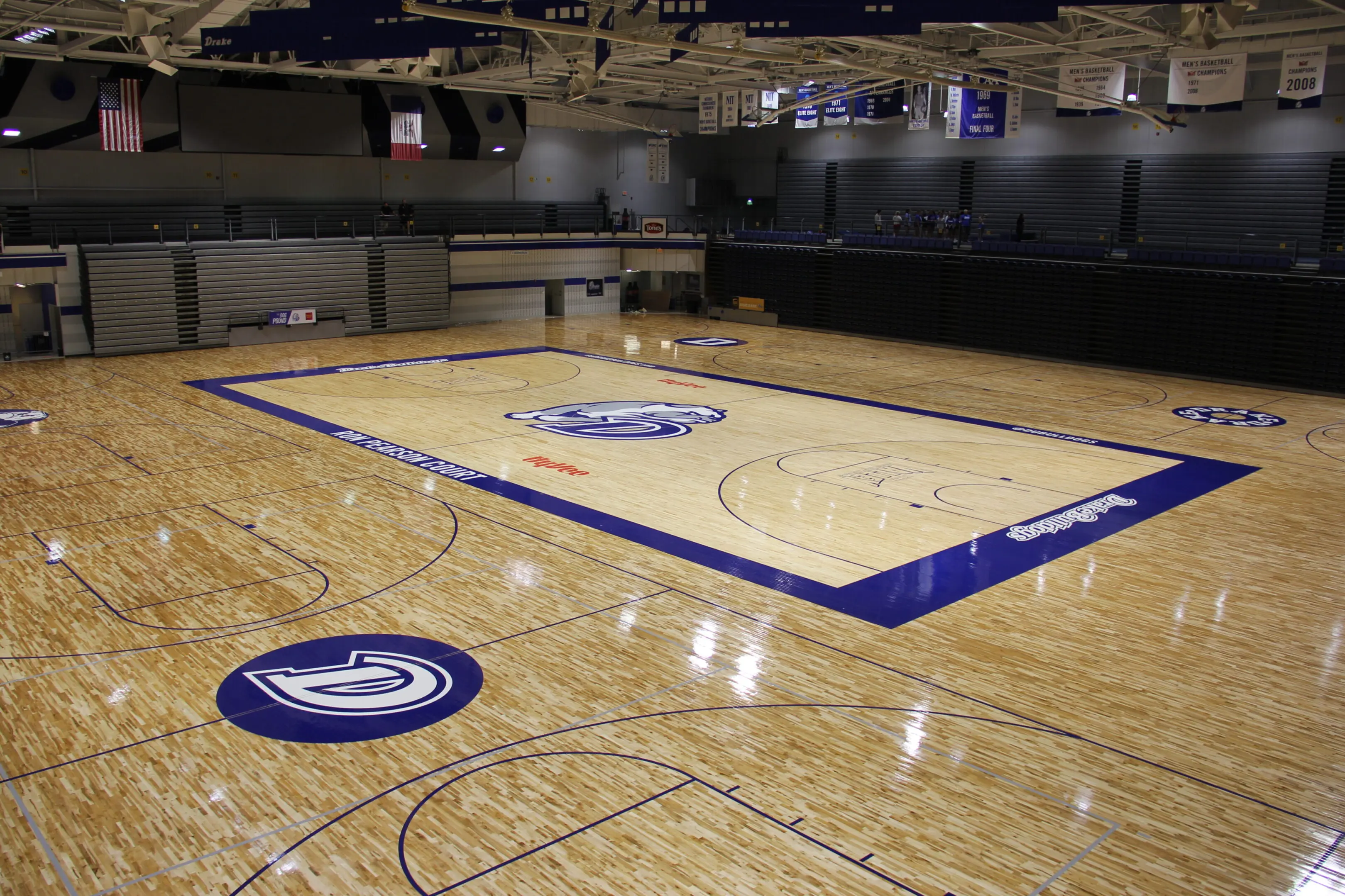 A basketball court with a large floor that has been painted.