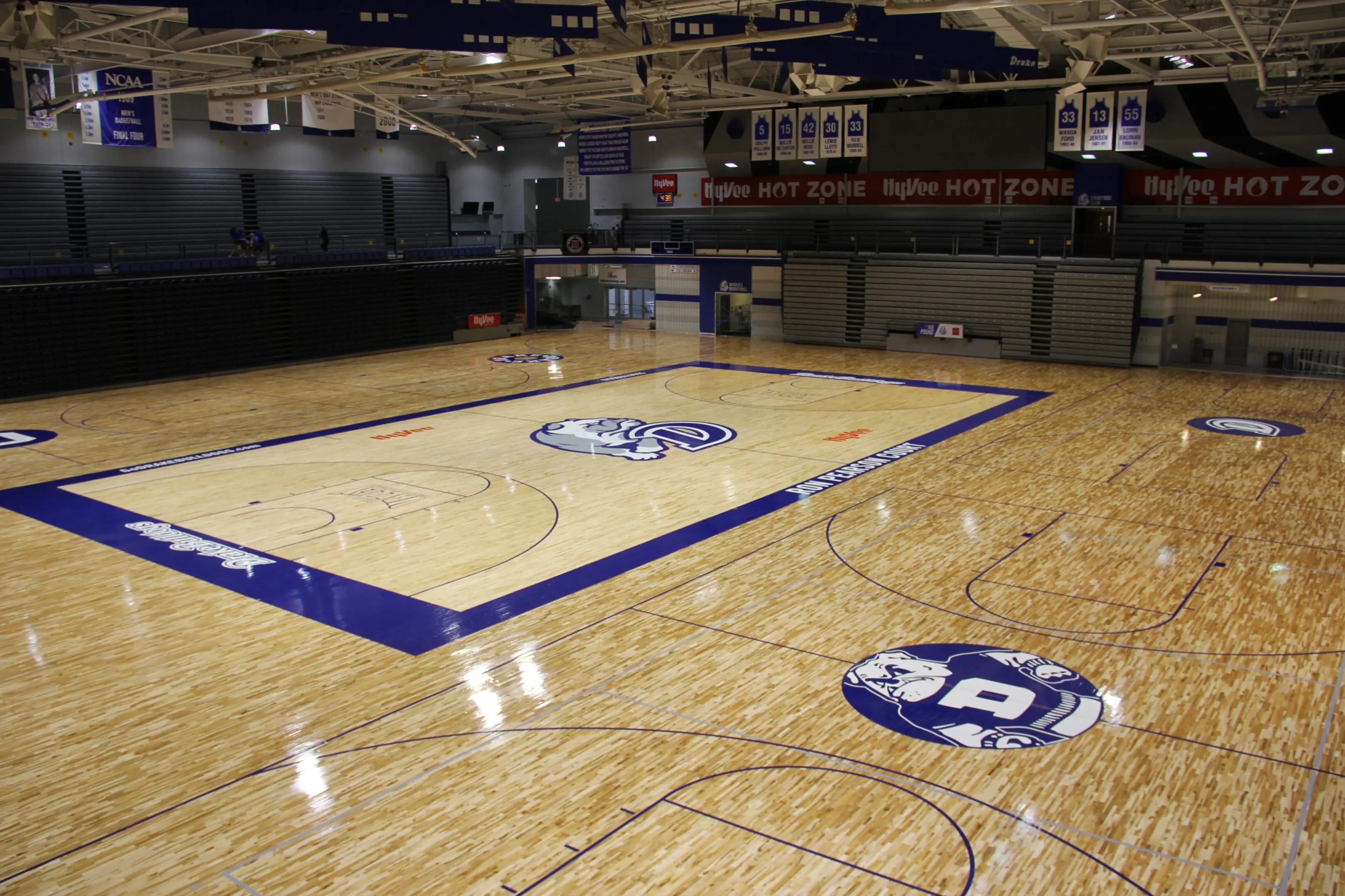 A basketball court with a large floor that has been painted.