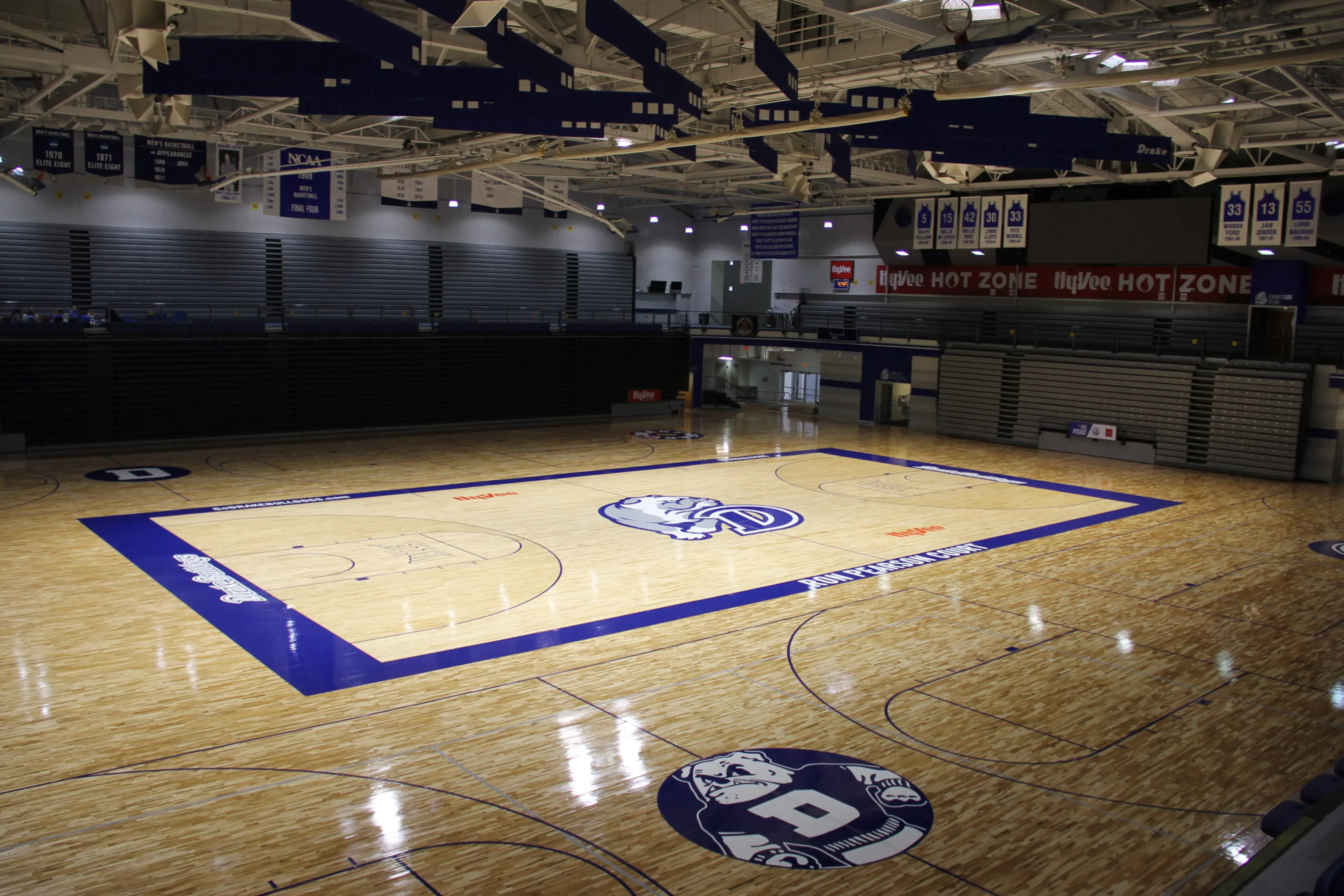 A basketball court with a blue and white logo.