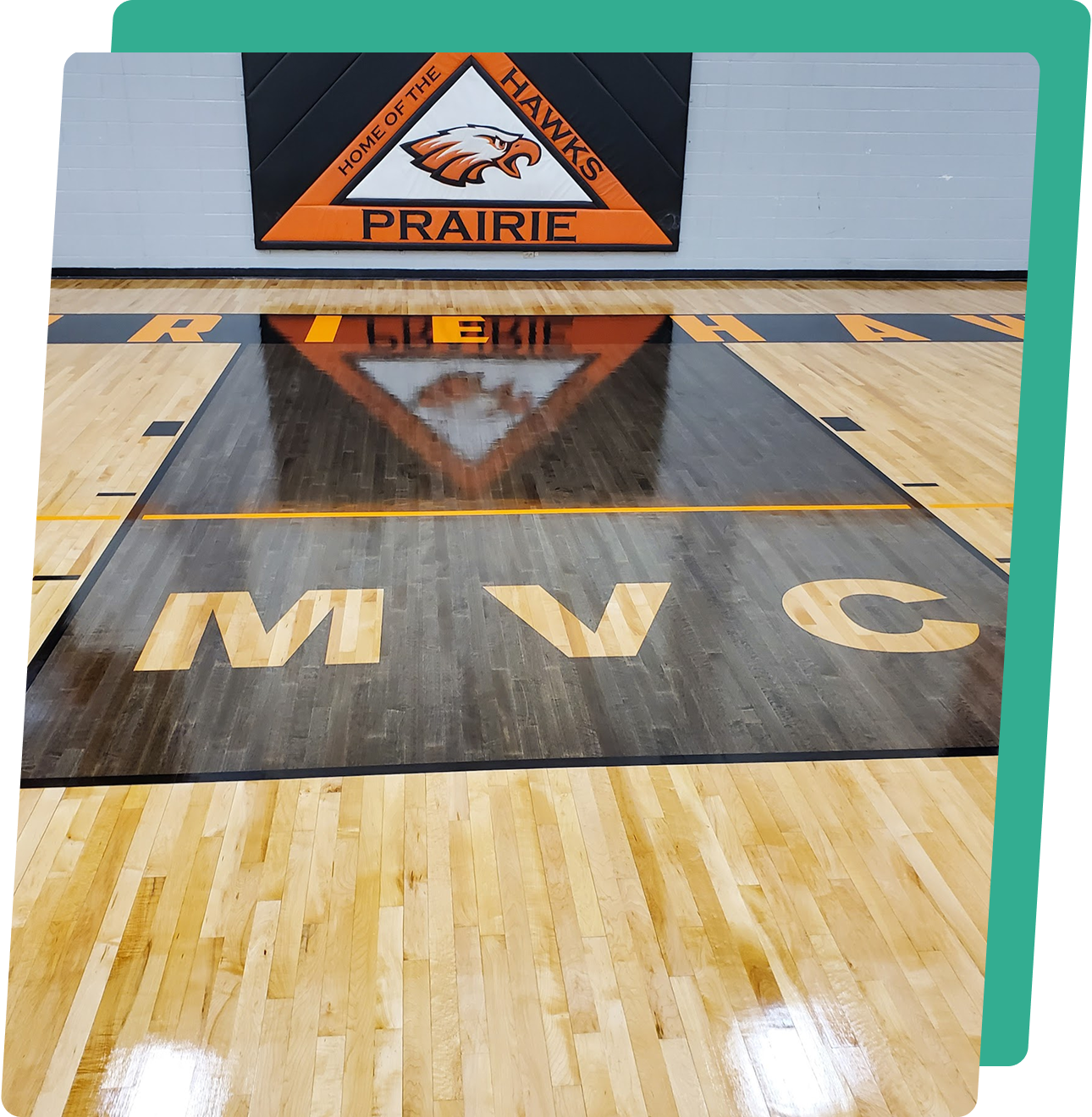 image2-2 A basketball court with the floor reflected in it.